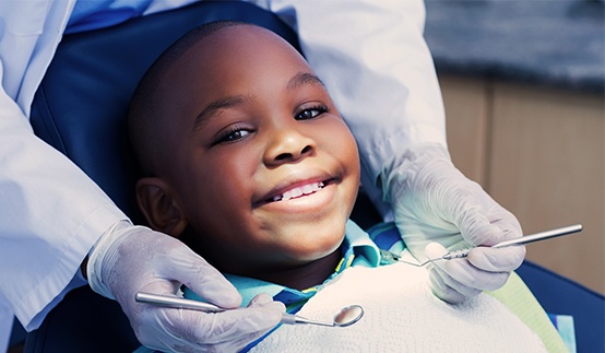 Young boy smiling during dental checkup