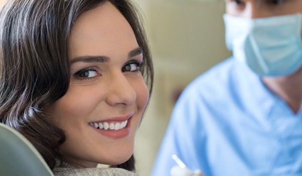 Woman smiling while in the dental chair