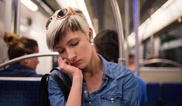 Woman falling asleep on train