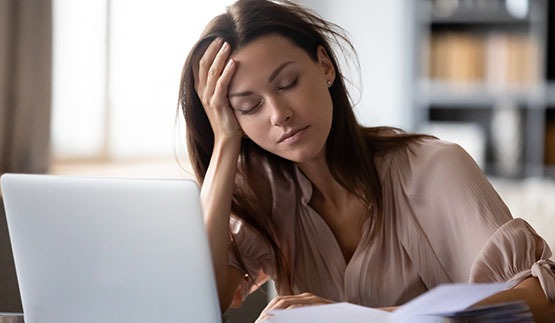 Woman tired at desk