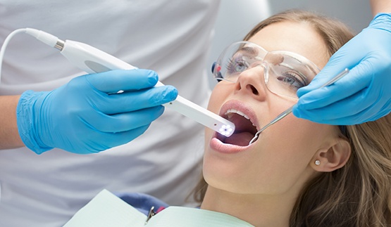 Dentist capturing digital images of a patient's mouth