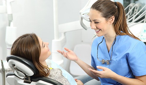 Patient talking to their dentist