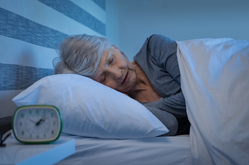 Older patient sleeping with dentures